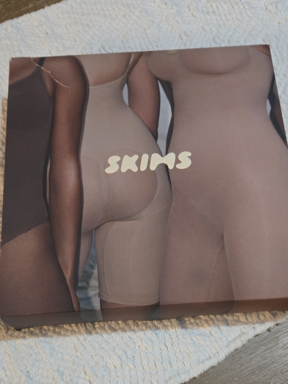SKIMS Sculpting Mid-Thigh Bodysuit in Nude Tones